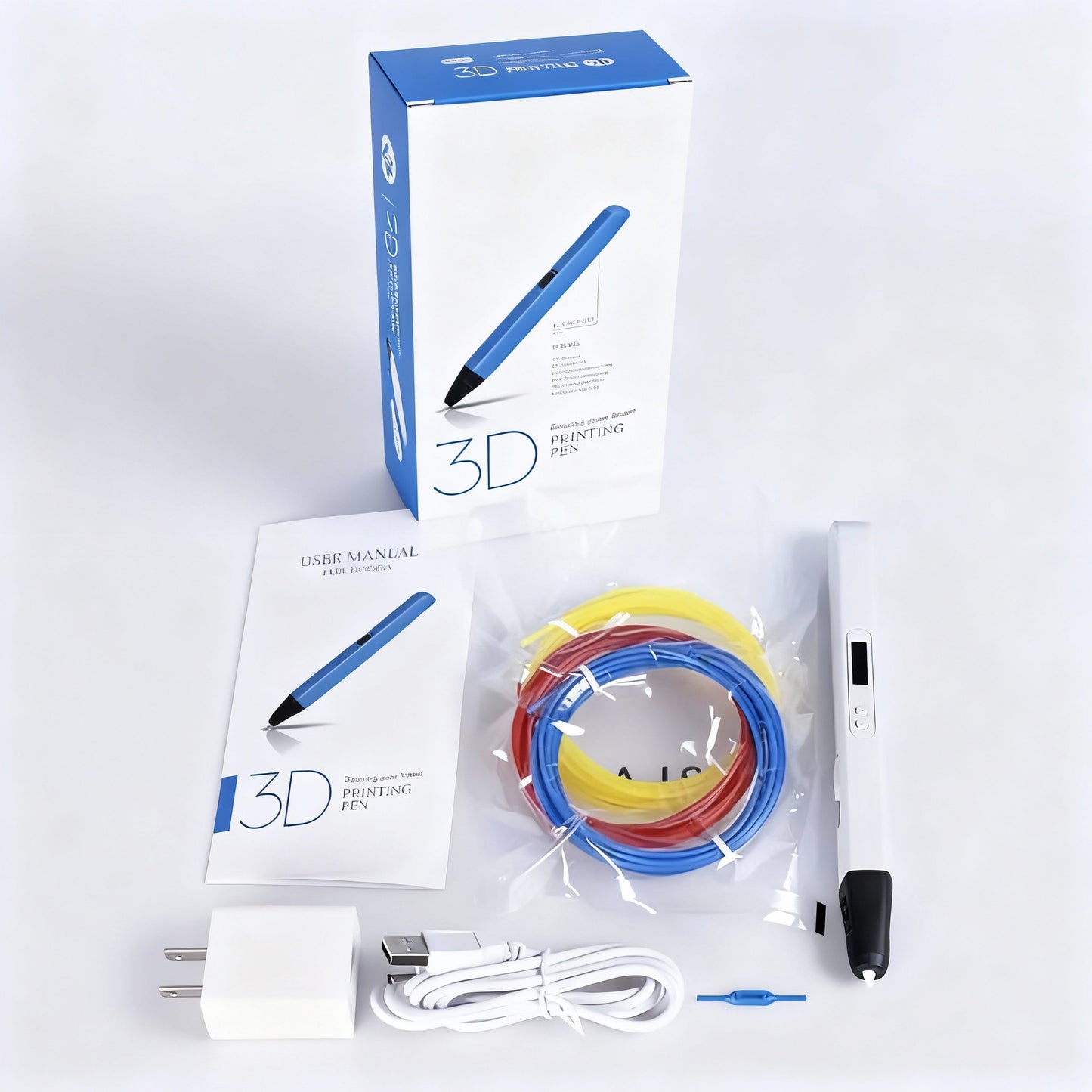 Stylo 3D Pro Lite - contenu du coffret avec stylo blanc, manuel, adaptateur USB, câble et 3 filaments PLA (bleu, rouge, jaune)